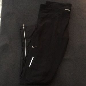 Nike dri-fit running tights with ankle zip.